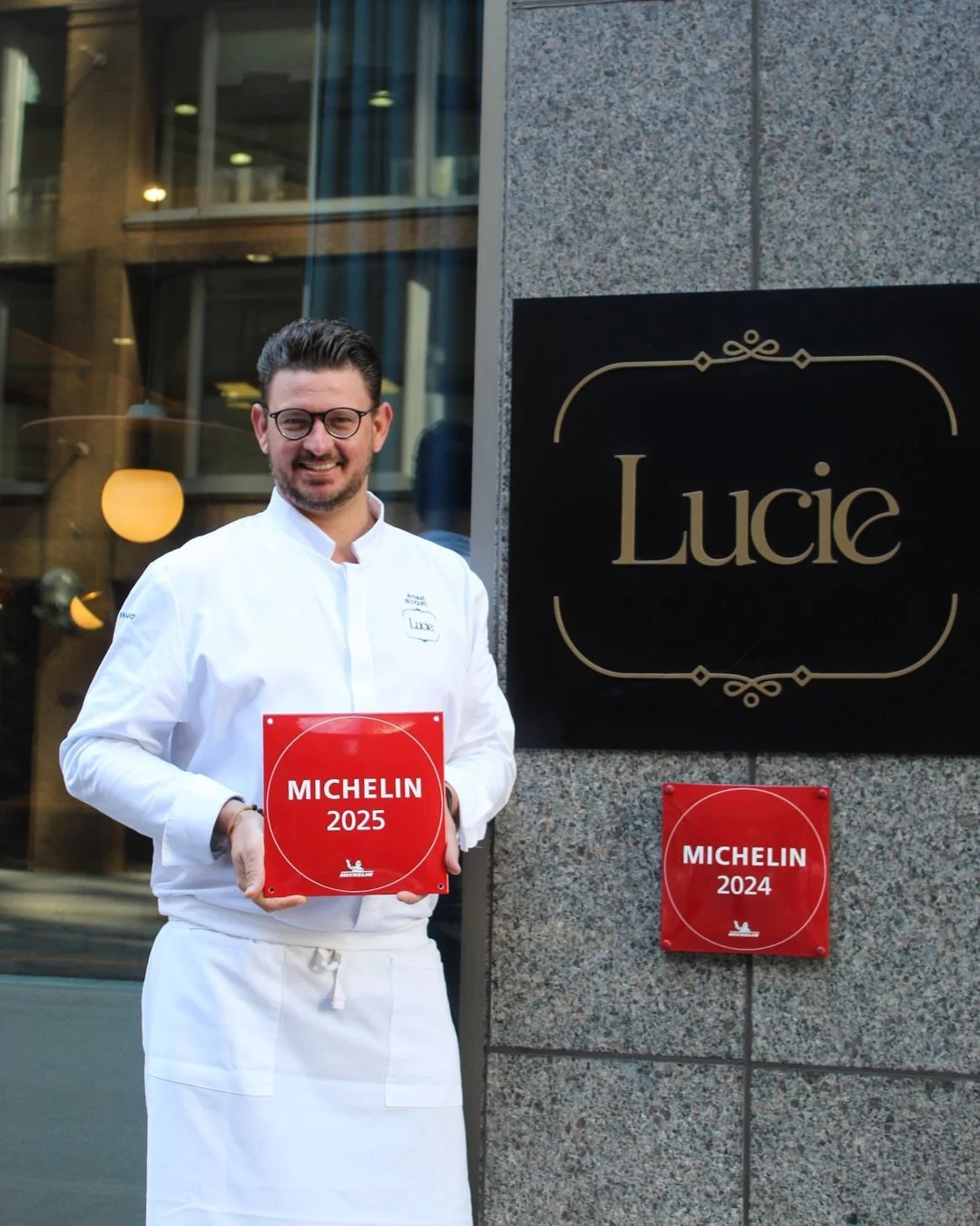 Executive Chef Arnaud Bloquel holding Michelin 2025 recognition outside Restaurant Lucie